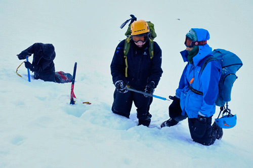 Digging a pit to look at the layers in the  snow pack